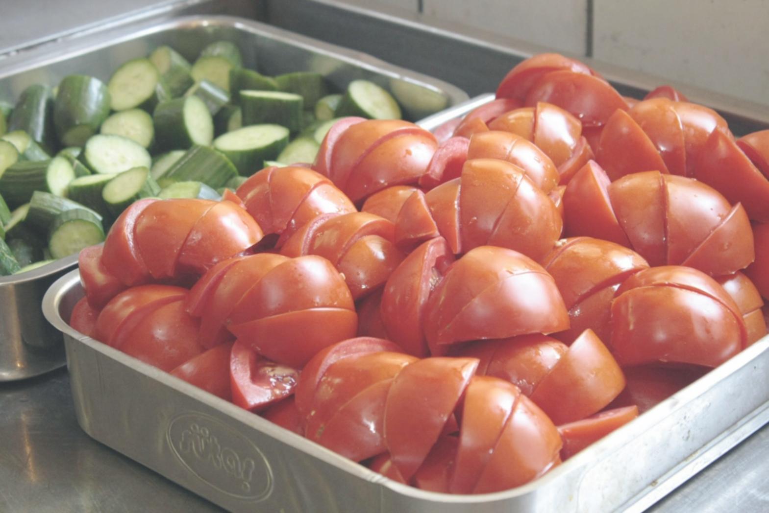 Professional chef demonstrating knife techniques in a modern home kitchen setting